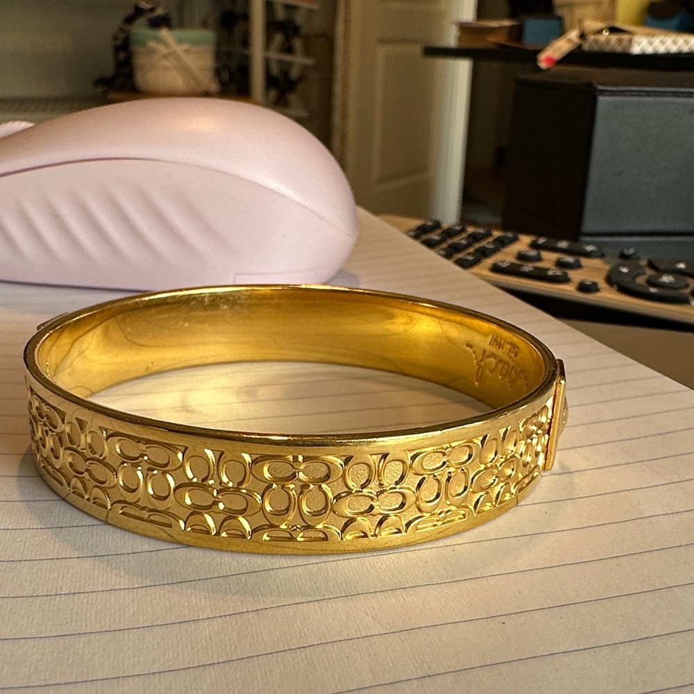 Gold Coach Patterned with C’s Bangle. Size is 8